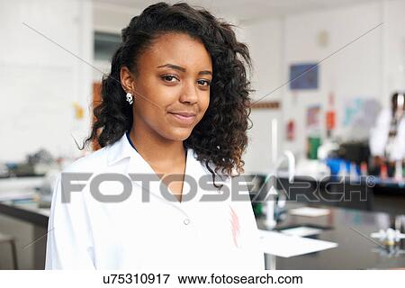 Portrait of young woman in laboratory View Large Photo Image Stock Photo - Portrait of young woman in laboratory. Fotosearch