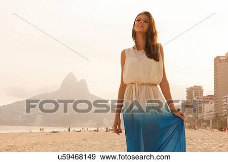Stock Photo - Portrait of young woman on Ipanema Beach, Rio de Janeiro, Brazil. Fotosearch