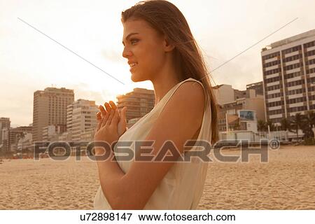 Stock Photo - Portrait of young woman on Ipanema Beach, Rio de Janeiro, Brazil. Fotosearch
