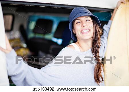 Portrait of young woman wearing beanie hat View Large Photo Image Stock Image - Portrait of young woman wearing beanie hat. Fotosearch