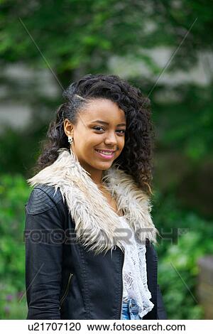 Portrait of young woman wearing coat View Large Photo Image Stock Image - Portrait of young woman wearing coat. Fotosearch