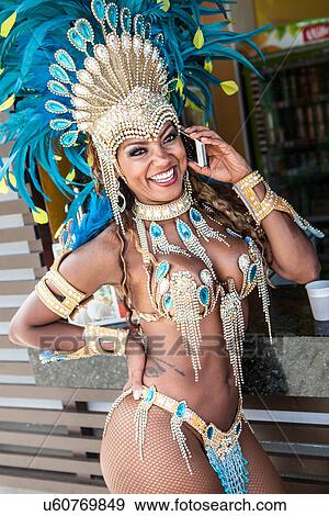 Stock Photo - Samba dancer on cellphone, Rio De Janeiro, Brazil. Fotosearch