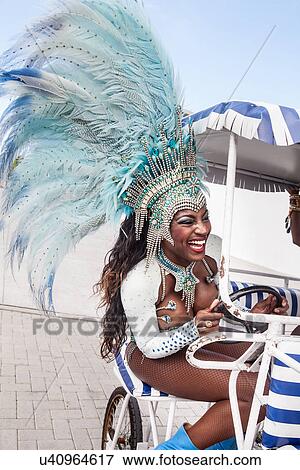 Samba dancer riding cart, Rio De Janeiro, Brazil View Large Photo Image Stock Photo - Samba dancer riding cart, Rio De Janeiro, Brazil. Fotosearch