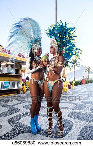 Samba dancers drinking coconut drink, Ipanema Beach, Rio De Janeiro, Brazil View Large Photo Image Stock Image - Samba dancers drinking coconut drink, Ipanema Beach, Rio De Janeiro, Brazil. Fotosearch