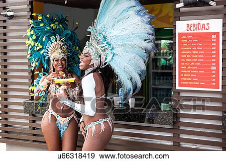 Samba dancers having hot dogs, Rio De Janeiro, Brazil View Large Photo Image Stock Photo - Samba dancers having hot dogs, Rio De Janeiro, Brazil. Fotosearch