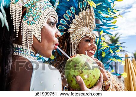 Samba dancers in costume, drinking coconut drinks, Ipanema Beach, Rio De Janeiro, Brazil View Large Photo Image Stock Image - Samba dancers in costume, drinking coconut drinks, Ipanema Beach, Rio De Janeiro, Brazil. Fotosearch