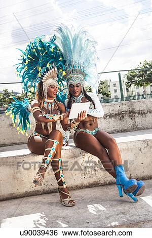 Samba dancers in costume, using digital tablet, Rio De Janeiro, Brazil View Large Photo Image Stock Photograph - Samba dancers in costume, using digital tablet, Rio De Janeiro, Brazil. Fotosearch