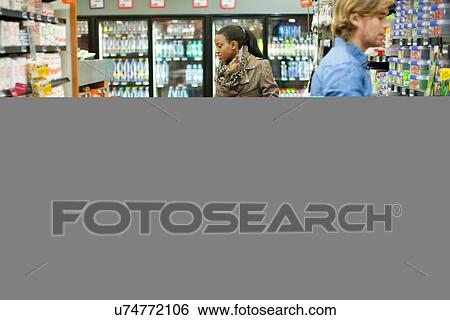 Shoppers in supermarket View Large Photo Image Stock Photograph - Shoppers in supermarket. Fotosearch
