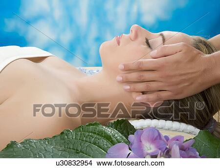 Side view of woman having head massage View Large Photo Image Picture - Side view of woman having head massage. Fotosearch