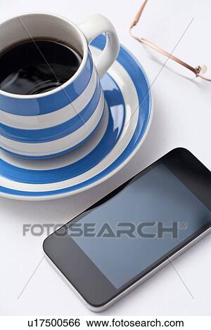Smartphone and coffee View Large Photo Image Stock Photograph - Smartphone and coffee. Fotosearch