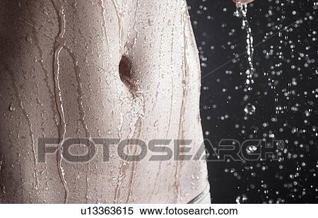 Stock Photography - Stomach under shower. Fotosearch