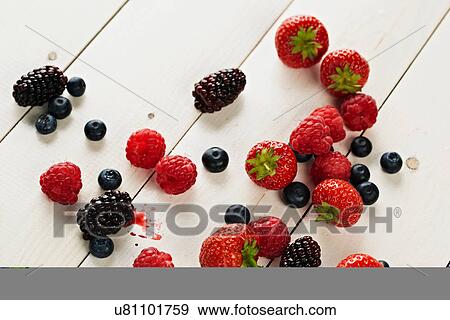 Stock Photo - Strawberries, raspberries, blackberries and blueberries still life. Fotosearch