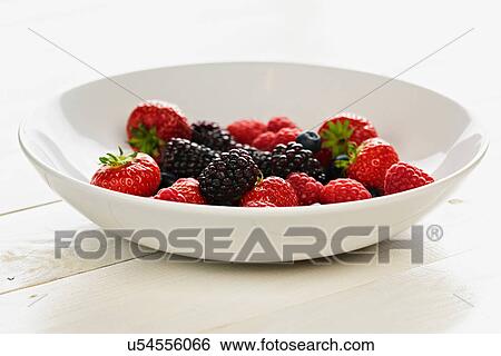 Strawberries, raspberries, blackberries and blueberries in bowl View Large Photo Image Stock Photograph - Strawberries, raspberries, blackberries and blueberries in bowl. Fotosearch