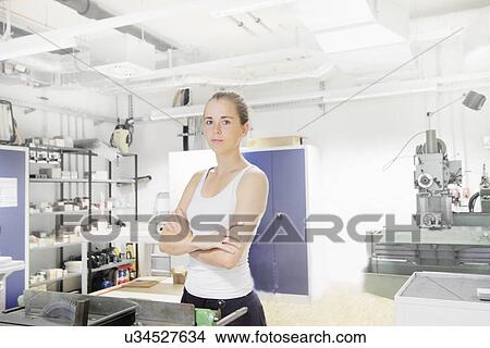 Technician working in optical laboratory View Large Photo Image Picture - Technician working in optical laboratory. Fotosearch