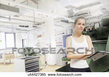 Stock Photography - Technician working in optical laboratory. Fotosearch
