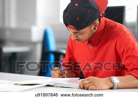 Teenage boy studying View Large Photo Image Stock Photograph - Teenage boy studying. Fotosearch