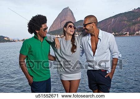 Three friends with arms around each other, Rio de Janeiro, Brazil View Large Photo Image Stock Image - Three friends with arms around each other, Rio de Janeiro, Brazil. Fotosearch
