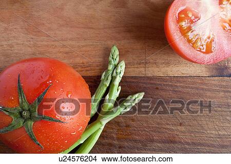 Tomato and asparagus, high angle View Large Photo Image Picture - Tomato and asparagus, high angle. Fotosearch