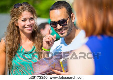 Tourists looking at map View Large Photo Image Stock Image - Tourists looking at map. Fotosearch