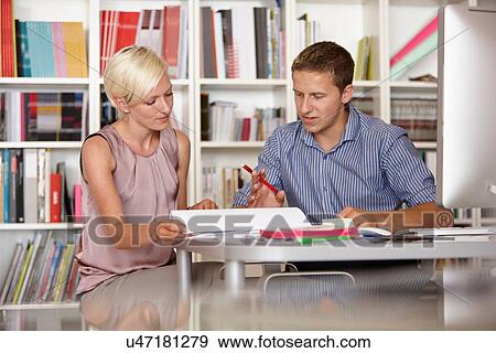 Stock Photo - Two colleagues in discussion. Fotosearch