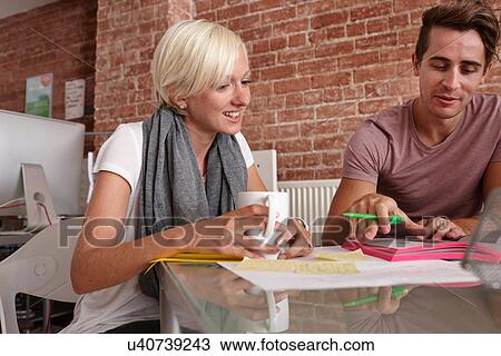 Two colleagues talking, woman with coffee View Large Photo Image Stock Image - Two colleagues talking, woman with coffee. Fotosearch