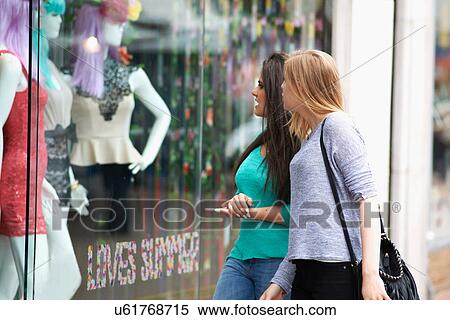 Stock Photography - Two teenage girls window shopping. Fotosearch