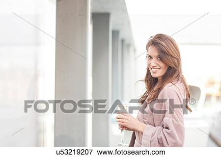 Woman at hotel poolside with glass of champagne View Large Photo Image Stock Photo - Woman at hotel poolside with glass of champagne. Fotosearch
