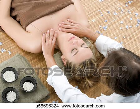 Picture - Woman at spa having shoulder massage. Fotosearch