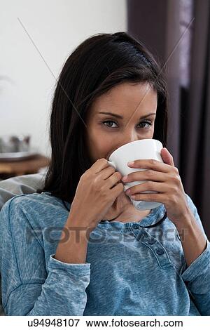 Stock Photo - Woman drinking cup of coffee. Fotosearch