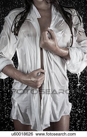Woman in drenched shirt under shower View Large Photo Image Stock Photograph - Woman in drenched shirt under shower. Fotosearch