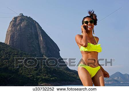 Stock Image - Woman on cell phone, Rio de Janeiro, Brazil. Fotosearch