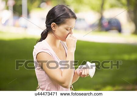 Woman suffering from hay fever View Large Photo Image Stock Image - Woman suffering from hay fever. Fotosearch