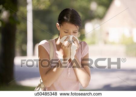 Woman suffering from hay fever View Large Photo Image Stock Photo - Woman suffering from hay fever. Fotosearch