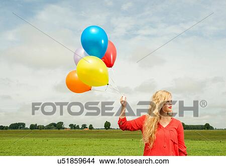 Woman with balloons View Large Photo Image Picture - Woman with balloons. Fotosearch