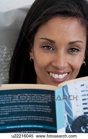 Stock Photography - Woman with book, close up. Fotosearch