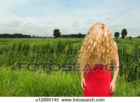 Stock Photography - Woman with hair covering face. Fotosearch