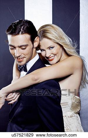 Stock Photo - Young couple dancing closely in nightclub. Fotosearch