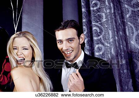 Young couple having fun in nightclub View Large Photo Image Stock Image - Young couple having fun in nightclub. Fotosearch