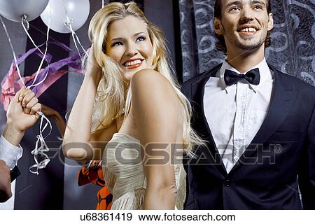 Young couple having fun in nightclub View Large Photo Image Stock Photo - Young couple having fun in nightclub. Fotosearch