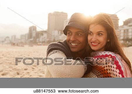 Stock Image - Young couple on beach. Fotosearch