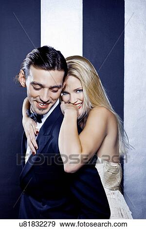 Stock Photo - Young couple posing in nightclub. Fotosearch