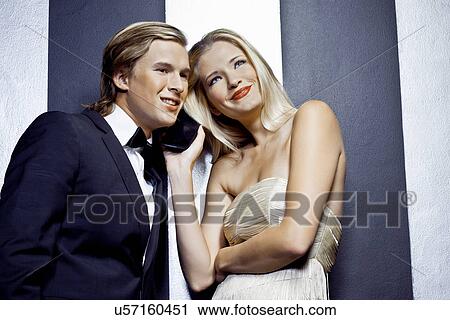 Young couple sharing mobile phone View Large Photo Image Stock Image - Young couple sharing mobile phone. Fotosearch