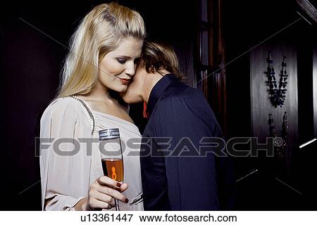 Young couple sharing romantic moment in club View Large Photo Image Stock Photo - Young couple sharing romantic moment in club. Fotosearch