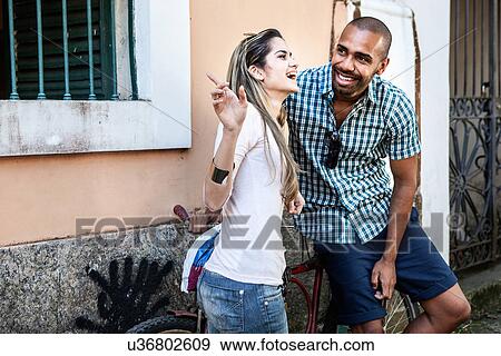 Stock Photo - Young couple talking, Rio de Janeiro, Brazil. Fotosearch