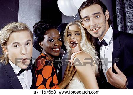 Young friends having fun in nightclub View Large Photo Image Stock Image - Young friends having fun in nightclub. Fotosearch