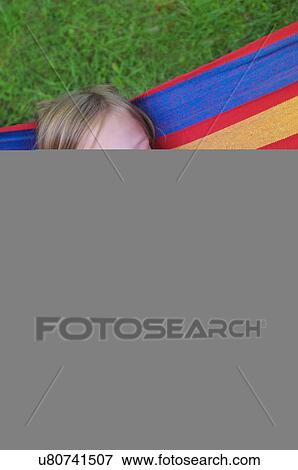 Young girl resting in hammock View Large Photo Image Stock Photo - Young girl resting in hammock. Fotosearch