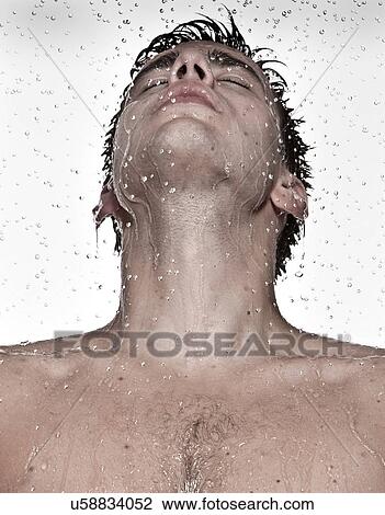 Young man showering View Large Photo Image Stock Image - Young man showering. Fotosearch