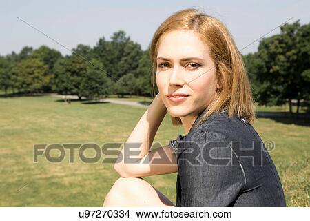 Picture - Young woman in park. Fotosearch