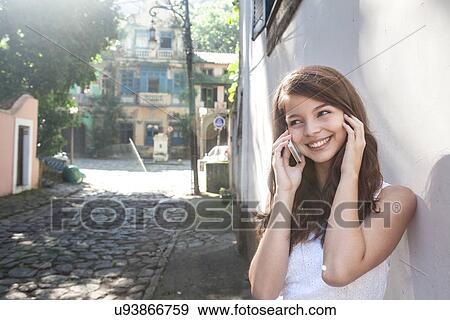 Young woman on cell phone, Rio de Janeiro, Brazil View Large Photo Image Stock Photo - Young woman on cell phone, Rio de Janeiro, Brazil. Fotosearch
