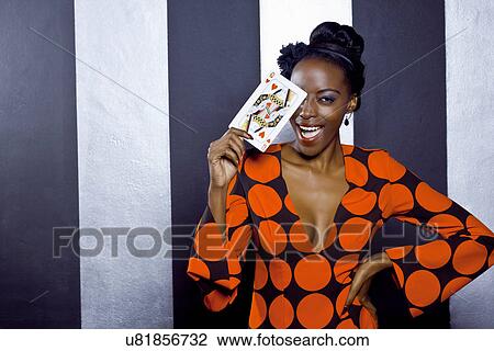 Young woman posing with playing card View Large Photo Image Stock Image - Young woman posing with playing card. Fotosearch
